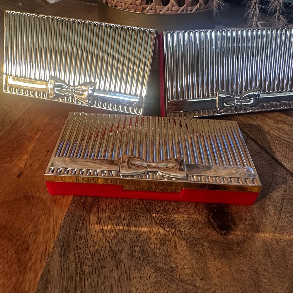 Estée Lauder Gold and Silver Clutch with Bow Accent